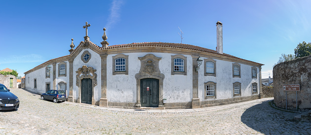 Sernancelhe Viseu Portugal - 09 24 2023: Panoramic exterior view at the iconic Solar dos Carvalhos manor, a 18th century building, on Sernacelhe village downtown, Viseu, Portugal