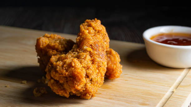 istock Crispy fried chicken on a wooden tray 1755624070