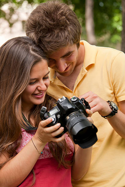 istock happy young couple looking at their camera 175562817