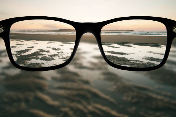 istock Eyeglasses focusing a beach at sunset 1755630200