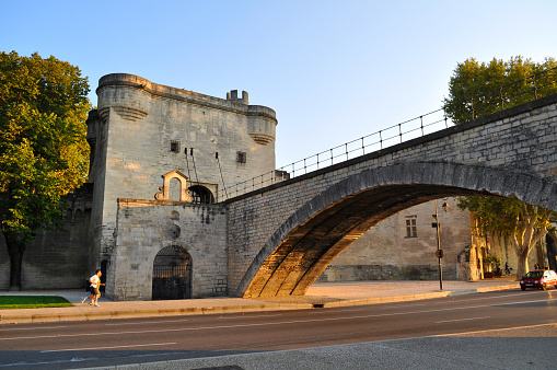 Avignon, France - September 29, 2011: Old stone bridge in the city center on the river Rhone embankment.