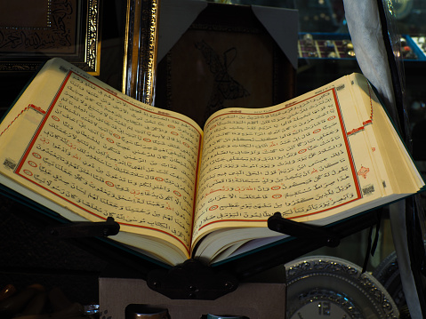 Pages opened Qur'an on its tray