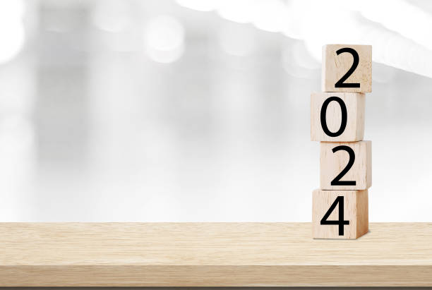 istock Happy New Year 2024 on wood cube block and blur abstract bokeh light with copy space background, Happy new year 2024 greeting card, banner 1755666121