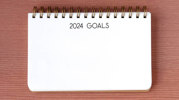 istock 2024 goals on blank notebook paper on white background, 2024 new year mock up, template, flat lay 1755666653