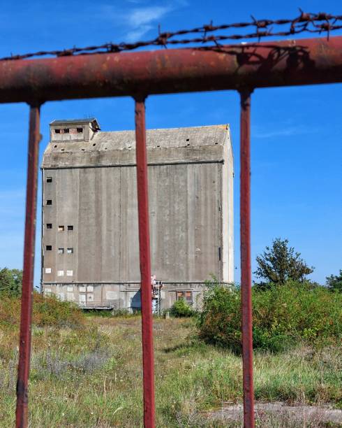 istock Abandoned concrete silo in Germany behind steel bars and barbed wire 1755667268