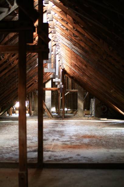 Old and abandoned attic of a big building.