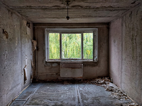 Lüderitz Ghost Town Building Interior Panorama. Old rotting domestic room inside Ghost Town Building with Sunlight and Shadow Textures reflecting from the open roof. Old Building of abandoned Kolmanskop Diamond Mine, Lüderitz, Namibia, Africa