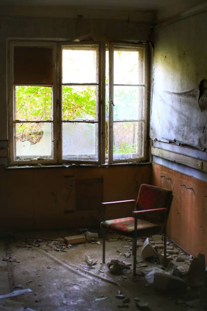 istock Armchair between debris in front of broken window 1755667309
