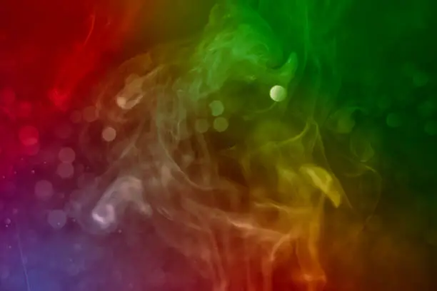 Photo of Rainbow abstract texture Smoke Background. red bokeh and blue bokeh