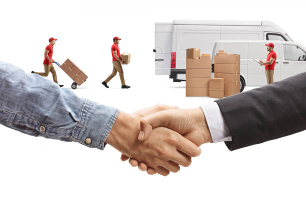 Men shaking hands in front of workers with a van, shipping company isolated on white background