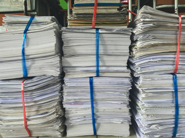 istock stacks of Newspapers for recycling 1755684660