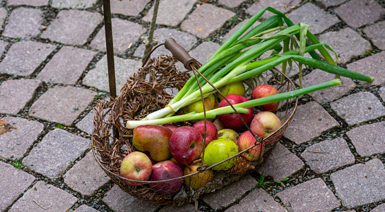 onions with Apples in a basket on the market