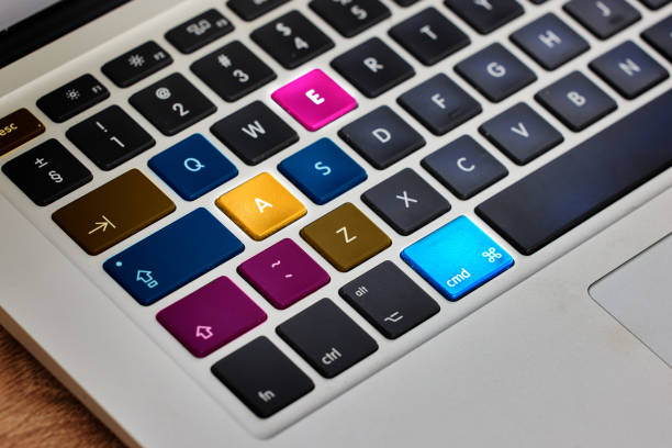 Laptop, keyboard and color technology in closeup on internet, website or information on a table. Digital, computer and electronic pc on desk for work, email or networking in communication on hardware
