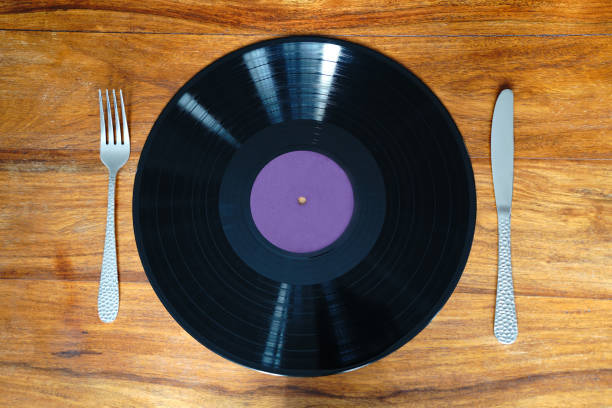 istock Vinyl record instead of dinner plate with knife and fork 1755697195