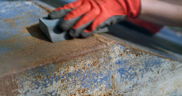 istock Boat DIY restoration. Cleaning off old paint from rusted surface 1755697759