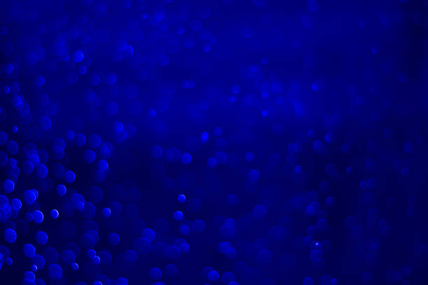Blue glitter vintage lights background. Blue bokeh background.