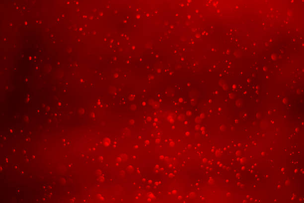 istock White bokeh on red background. Red heart boked 1755714919