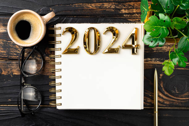 istock New year resolutions 2024 on desk. 2024 resolutions list with notebook, coffee cup on table. Goals, resolutions, plan, action, checklist concept. New Year 2024 template 1755718777