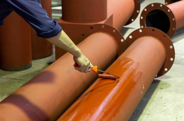 Rust-proof painted steel pipes in the factory Rust-proof painted steel pipes in the factory. Red iron pipe rustproof stock pictures, royalty-free photos & images