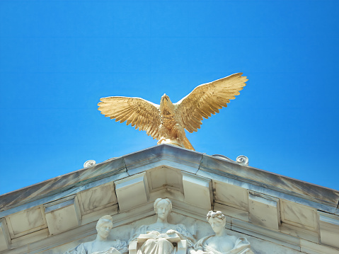 Stunning golden eagle statue perched atop the Vicksburg Civil War Battlefield monument, paying tribute to the history and heritage of the Civil War era in Mississippi, USA.