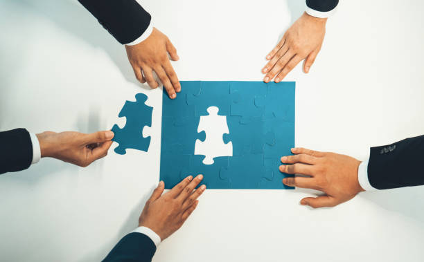 istock Top view panorama banner of business team assembling jigsaw puzzle. Shrewd 1755736876