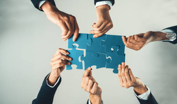 istock Top view panorama banner of business team assembling jigsaw puzzle. Shrewd 1755746145