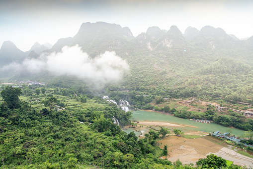 view of Detian or Ban Gioc waterfall, Cao Bang, Vietnam. Ban Gioc waterfall is one of the top 10 waterfalls in the world. Travel and landscape concept.