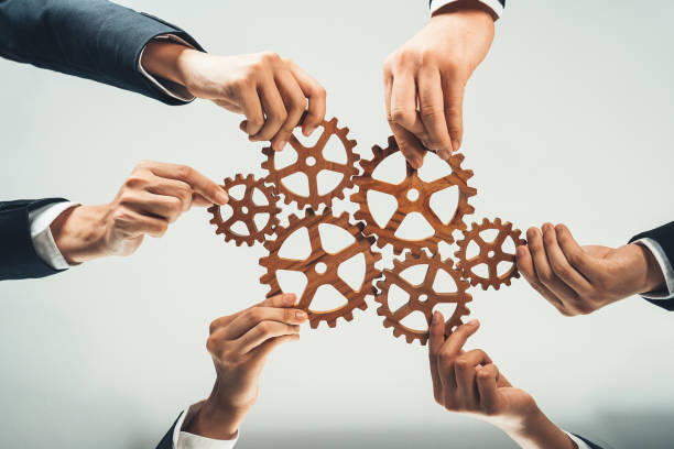 istock Business team joining cogwheel in circular together. Shrewd 1755752041