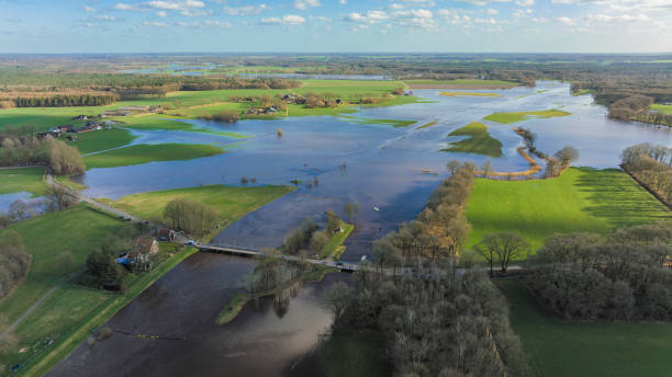 Vecht river high water level flooding at the Junne weir drone view