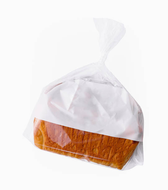 istock Loaf of wheat bread in plastic bag isolated 1755757743