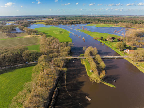 istock Vecht river high water level flooding at the Junne weir drone view 1755758351