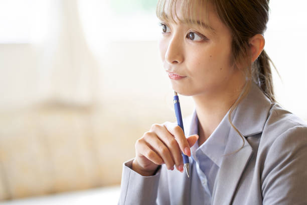 istock Asian woman worried while working at a cafe 1755759500
