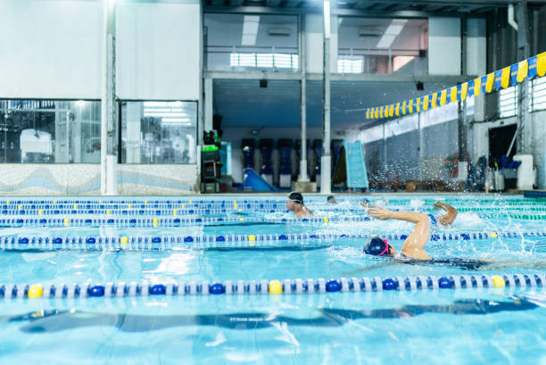 istock People swimming in the swimming pool 1755776031