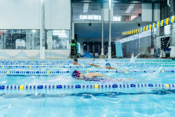 istock People swimming in the swimming pool 1755776039