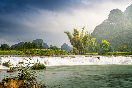 Scenery of clear streams and countryside, peaceful nature in Trung Khanh, Cao Bang province, Vietnam with river, nature, green rice fields. Near Ban Gioc waterfall. Travel and landscape concept.