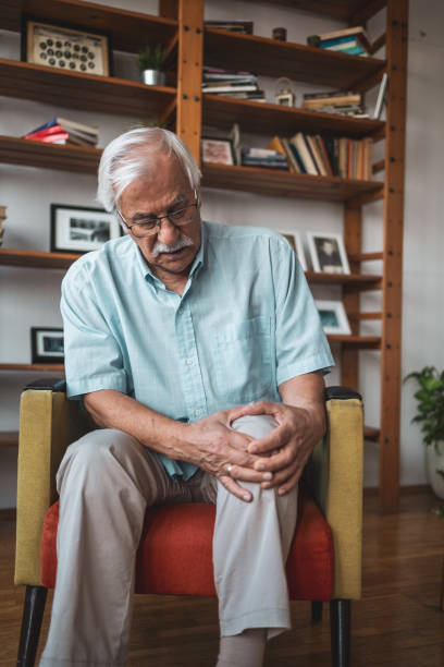 istock Man feeling pain in his knee 1755781753