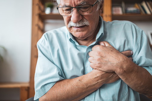 Close up of the man feeling the pain in his chest