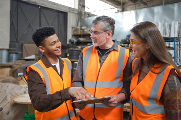 istock Group of recycling coworkers discussing in warehouse 1755801470