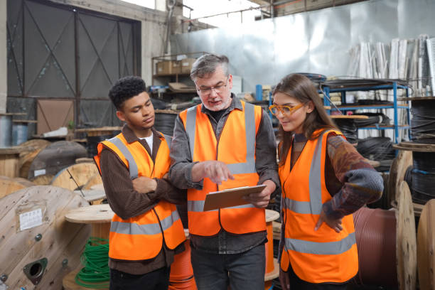 istock Recycling coworkers discussing in warehouse 1755805892