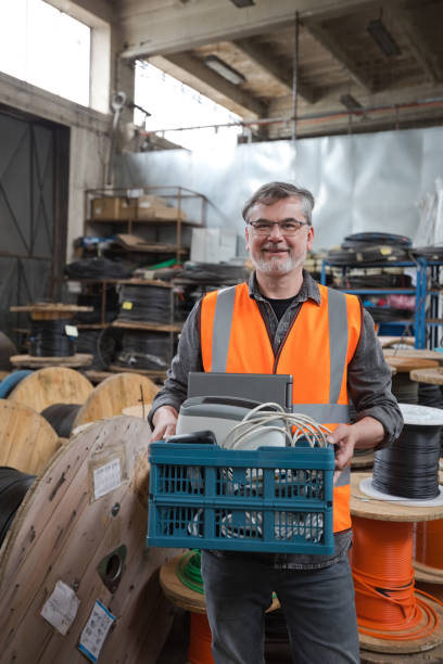 istock Recycling worker standing in warehouse with recycling bin 1755808166