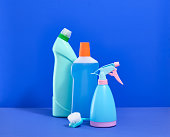 Cleaning products on a blue background. Idea of cleanliness.