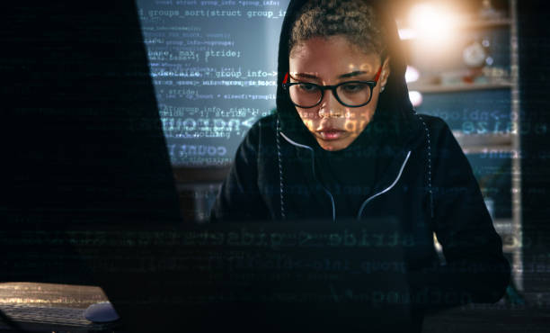 istock Hacker, woman in dark room with laptop and code, data analysis and IT, phishing and cyber crime with database. Cybersecurity, programming and criminal with pc, overlay or hologram with ransomware 1755830954