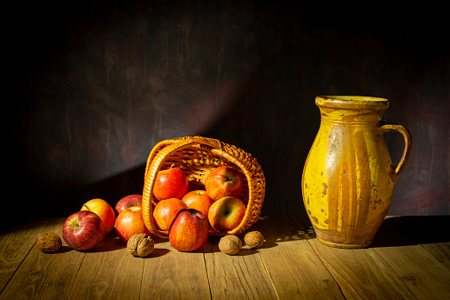Still life with apples in a wicker basket