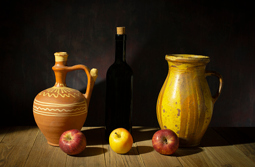 Still life with apples and ceramic vases