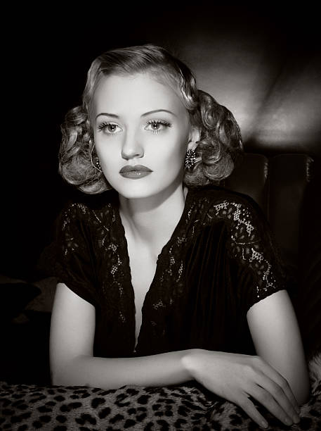 Film Noir style Female portrait Emulation of vintage style photography.Grain added for more film effect.See the Lightbox: film noir style photos stock pictures, royalty-free photos & images