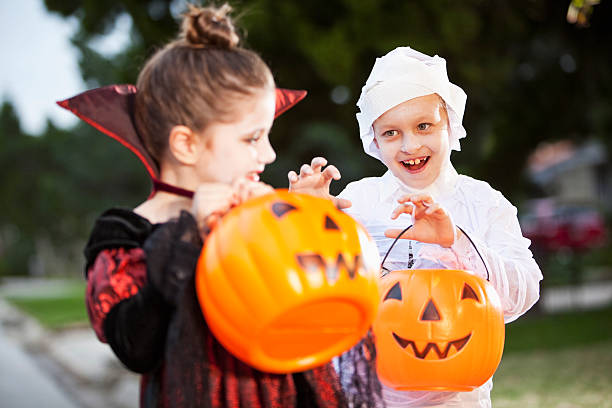 istock Children in halloween costumes 175585809