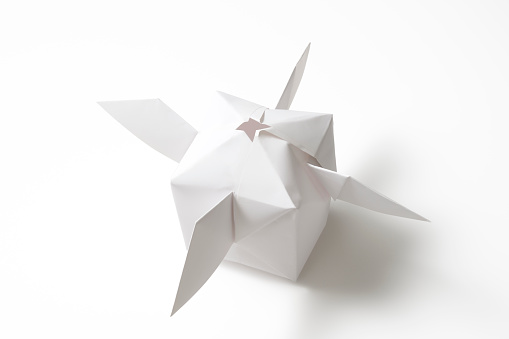 High angle view of blank origami satellite isolated on white background with clipping path.