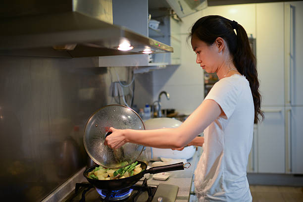 Woman Cooking At Home - XXXLarge stock photo