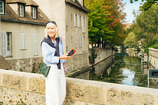 Female tourist at Pont Bouju in the town of Chartres, south west of Paris, France.