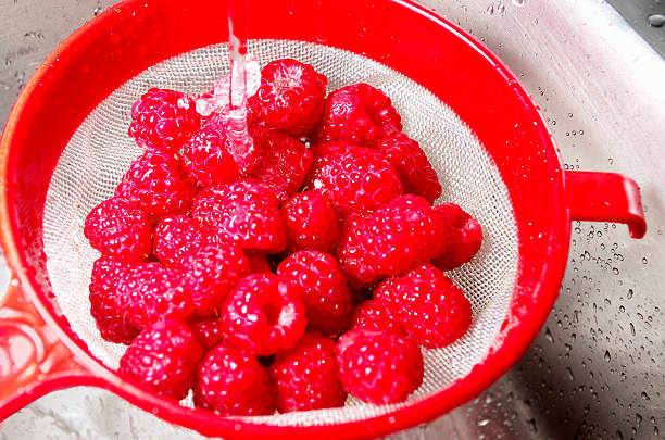 istock Raspberries Being Washed In Sieve 175587694
